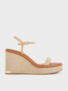 During summertime, no outfit is complete without a pair of espadrilles. Incorporate these woven wedges into your warm-weather wardrobe to ensure you are always stylish and prepared for a seaside stroll or tropical getaway. With their breathable open-toed design, your feet will stay cool and comfortable all day long. Plus, the 9.5cm wedge soles not only add tactile appeal but also offer stability and a height boost. Beach Straw Wedge Sandals With Cork-bed Midsoles, Straw Espadrilles With Woven Sole For Summer Outings, Comfortable Platform Espadrilles For The Beach, Summer Natural Espadrilles For Beach Season, Natural Color Summer Espadrilles For Beach Season, Summer Wedge Sandals With Cork-bed Midsoles For Vacation, Summer Espadrille Wedge Sandals With Textured Sole, Chic Wedge Sandals For Summer Beach, Natural Straw Espadrilles For Summer Outings