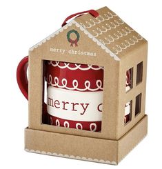 a red mug in a cardboard box with a merry christmas sign on the front and side