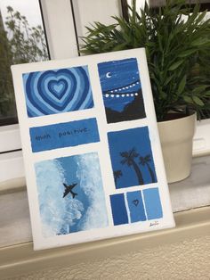 a painting on a window sill with blue and white squares, palm trees, and a heart