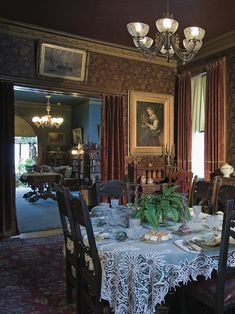 a dining room table is set with place settings