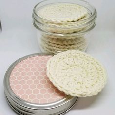 three jars filled with crochet coasters sitting next to each other