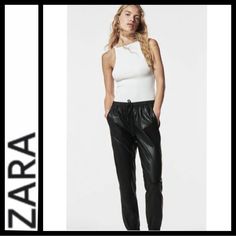 Nwot Zara High Waist Vegan Leather Joggers Sz S Elasticized Waistband; Drawstring Front Pockets High Waist Jogger Style Elasticized Cuffs Waist Measures Approx 14” Across Rise Approx 11.5” Inseam Approx 26” Black Buttery Soft Vegan Leather 100% Polyurethane Tags Removed, Never Worn Orig. $79 Leather Jogging Pants, Jogging Pants Black, Winter Wishlist, Striped Pant, Leather Joggers, Style Mood Board, Zara Jumpsuit, California Casual, Printed Wide Leg Pants