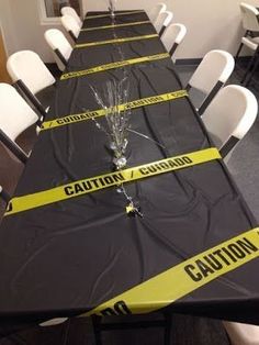 a long table with caution tape on it