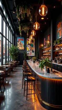 a bar with lots of stools and plants hanging from the ceiling in front of large windows