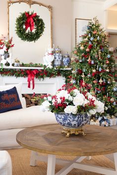 a living room decorated for christmas with red, white and blue decorations