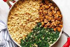 a pan filled with rice and spinach next to other food on top of a table