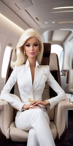 a barbie doll is sitting in an airplane