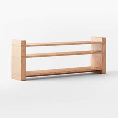 a wooden shelf sitting on top of a white floor