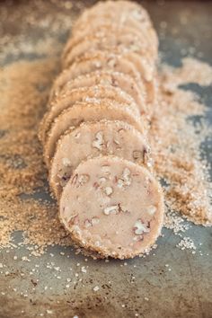 some food is laying out on a baking sheet and sprinkled with powdered sugar