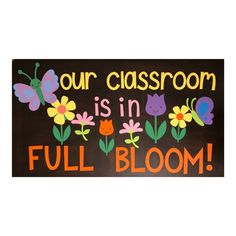 a sign that says our classroom is in full bloom with cats and flowers on it