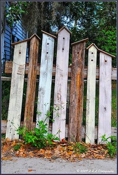 an old fence made out of wooden boards