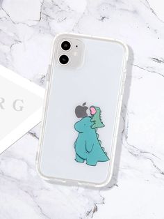 a phone case with an image of a dinosaur on it, sitting on a marble surface