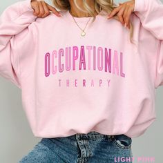 This Occupational Therapy Sweatshirt / Occupational Therapist Sweater is perfect for work or play! And makes a great gift for the OT or OTA!     **UNISEX SIZING** ♥ W E L C O M E  T O  S K E T C H Y  C A T  D E S I G N S ! ♥ Click here to return to our shop's home page ⇒ https://www.etsy.com/shop/SketchyCatDesigns Say hello to your new favorite sweatshirt! All of our products are printed with eco-friendly water-based inks, giving them the softest feel. The design itself is embedded into the fabr Occupational Therapy Shirt, Occupational Therapy Shirts, Midwife Gift, Therapy Gift, Ephesians 2, Gift Inspo, Pink Coquette, Occupational Therapist, S K