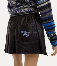 Our Cheerleader skirt features a straight front panel and pleated back, inspired by the silhouette of traditional kilts. The piece receives an elasticated waistband that ties at the front with an adjustable string, branded with our orb and lettering motifs to finish. Black Vivienne Westwood, Cheerleader Skirt, Eastpak Backpack, Men Trousers, Knitwear Tops, Bridal Couture, Shirt Skirt, Kilt, Corset Dress