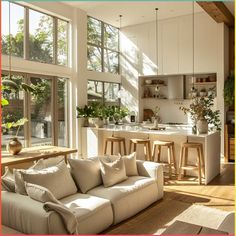 a living room filled with furniture and lots of windows next to a counter top oven