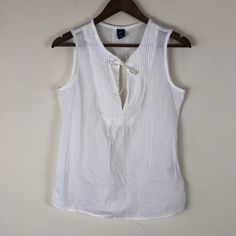 Super Cute Soft And Comfortable Light And Breezy Measurements Length Approximately 25” Bust Approximately 19” Gap Summer Blouse For Daywear, White Tank Vest For Summer, Summer White Tank Vest, White Gap Tops For Vacation, White Gap Tank Top For Spring, White Gap Tops For Summer, White Tank Top For Summer Daywear, Casual White Vest For Vacation, White Gap Blouse For Summer