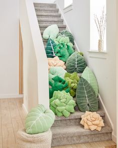 there are many pillows on the stairs