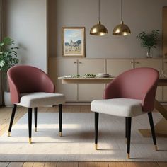 two pink chairs sitting in a living room next to a table and potted plant