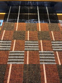 a close up view of a weaving machine