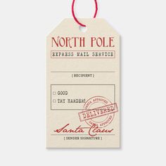 the north pole express mail service id is hanging from a red string on a white background