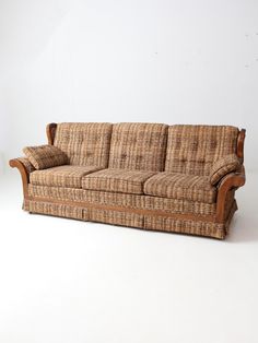 a brown couch sitting on top of a white floor