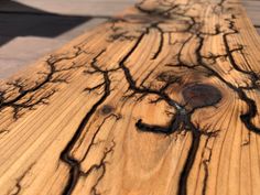 a wooden table with black lines on it