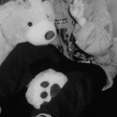 black and white photograph of two stuffed animals