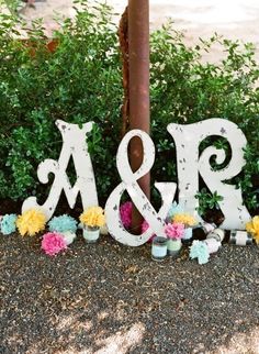 the letters are made out of wood and decorated with flowers