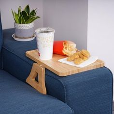 there is a tray with food on it next to a cup