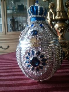 an elaborately decorated glass box on a table