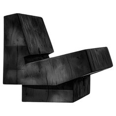 an artistic black and white photo of a chair made out of wooden planks,