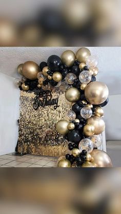 black, gold and white balloons are arranged in the shape of a frame