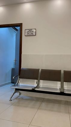 three empty seats are sitting in the waiting room