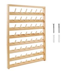 a wooden rack with two screws on the side and three pegs attached to it