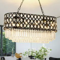 a chandelier hanging over a dining room table