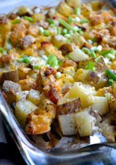 a casserole dish with potatoes, peas and meat