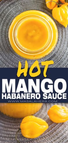 hot mango habanero sauce in a glass jar on top of a metal plate