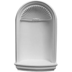 a white wall mounted fountain on a white background