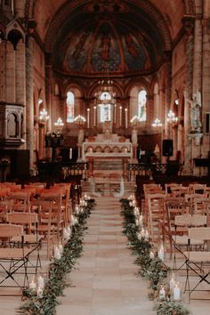 rows of chairs are lined up in front of the alter at a church with candles and greenery