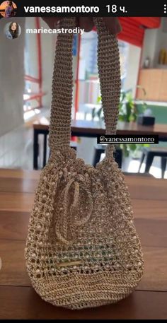 a handbag sitting on top of a wooden table