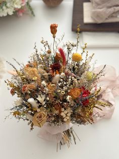 a bouquet of flowers sitting on top of a table