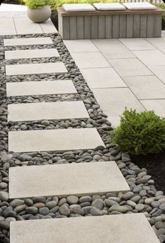 a walkway made out of stones and gravel