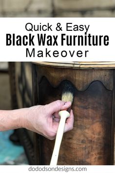 a person using a brush to paint the top of a wooden furniture piece with text overlay that reads quick & easy black wax furniture makeover