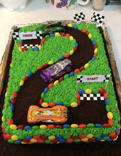 a birthday cake that is shaped like a race track