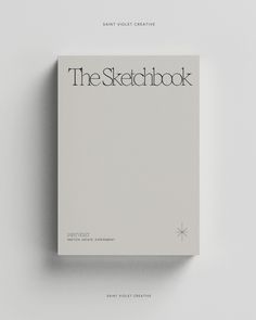 the sketchbook is sitting on top of a white surface with black lettering that reads,'the sketchbook '