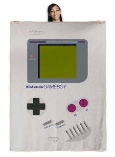 a woman holding up a poster with an old - fashioned gameboy design on it