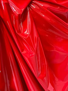 Shiny red four way stretch vinyl latex spandex fabric by the yard, 60'' wide.  Fabric is available in other colors. We do our best to ensure that our photos are as true to color as possible. Colors may vary per screen. We do not accept returns based on difference in color. For exact color matching please order a swatch. Latex Fabric, Sewing Pvc Fabric, Red Plastic Texture, Red Fabric Texture, Silk Fabric Red, Pvc Coated Polyester Sparkly Fabric, Technicolor Fabrics, Vinyl Aesthetic, Vinyl Fabric