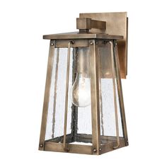 an outdoor wall light with a clear glass bulb