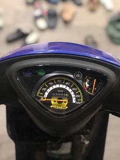 the speedometer is clearly visible for all to see on this motor scooter