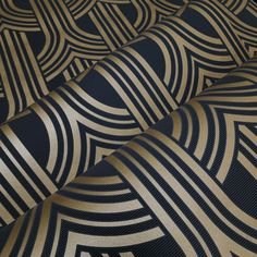 black and gold art deco wallpaper with wavy lines in the center, as well as an abstract design